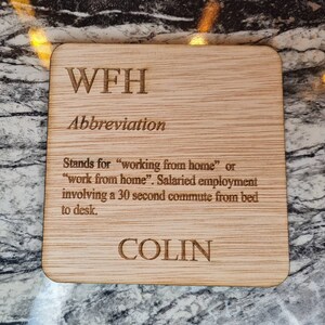 May include: Wooden coaster with the text "WFH Abbreviation" and a definition of the acronym. The coaster also has the name "COLIN" engraved on it.