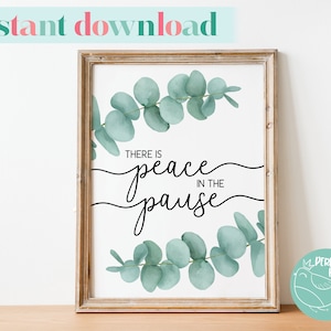 May include: A printable wall art print featuring a watercolour eucalyptus wreath and the text "There is peace in the pause".