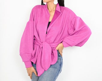 Pink wrap jacket with puff sleeves and attached tie