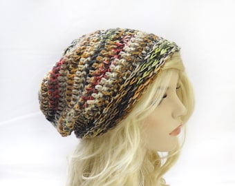 May include: A slouchy beanie hat with a multi-colored striped pattern in shades of brown, orange, red, and green.