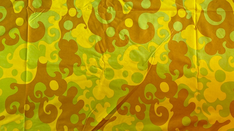 May include: Abstract fabric with a swirling pattern in shades of yellow, brown, and green.