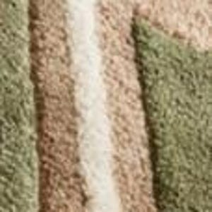 May include: Close-up of a textured rug with a geometric pattern. The rug features a combination of beige, olive green, and off-white colors. The design includes straight lines and angular shapes, creating a modern aesthetic.