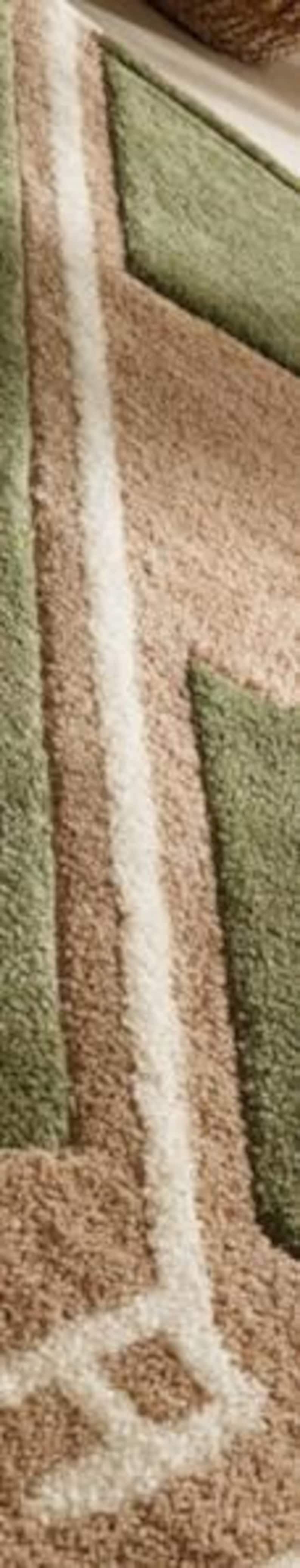 May include: Close-up of a textured rug with a geometric pattern. The rug features a combination of beige, olive green, and off-white colors. The design includes straight lines and angular shapes, creating a modern aesthetic.