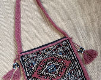 Vintage carpet bag with tassels.