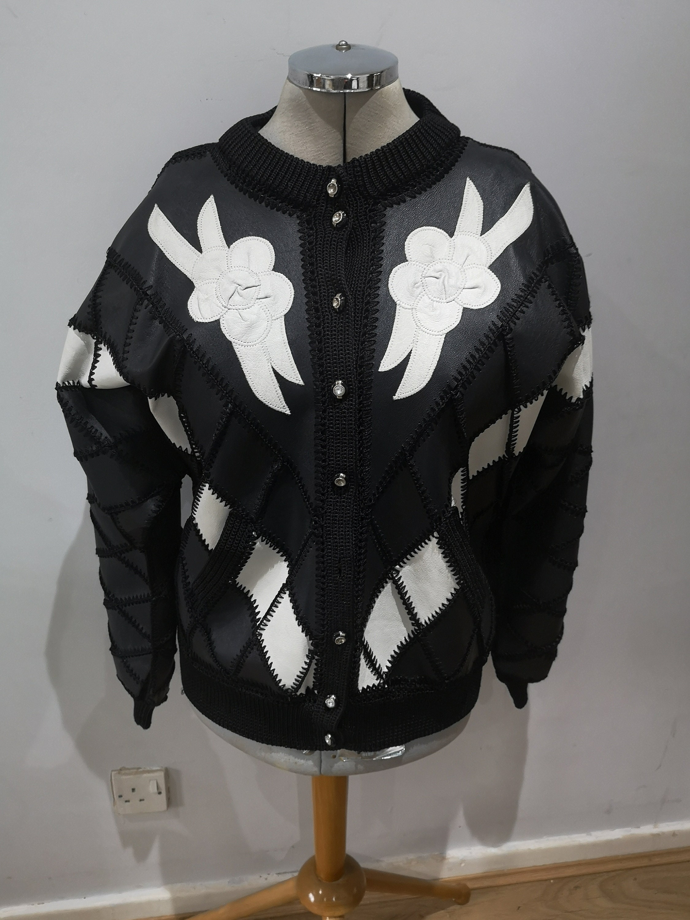 PenelopesAttire Vintage 1980's Leather and Crochet Patch Work Jacket with White Leather Flowers. 80's Black Leather Bomber Jacket with Flowers. UK 12