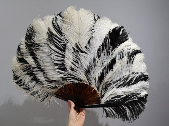 A large Edwardian ostrich feather and tortoiseshel