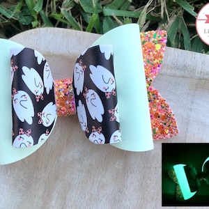 Glow in the dark orange ghosts bow