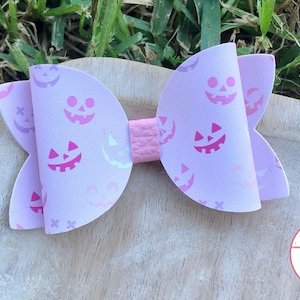 Pink jack o lantern Halloween bow