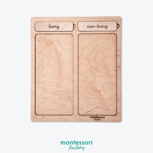 May include: Wooden sorting tray with two sections labeled "living" and "non-living". The tray is made of light wood and has a "montessori factory" logo.