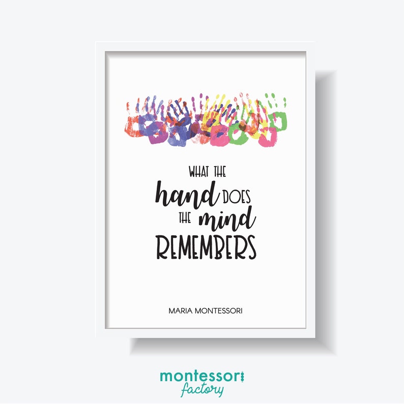 May include: A white framed print with a quote by Maria Montessori: "What the hand does the mind remembers." The quote is surrounded by colourful handprints.