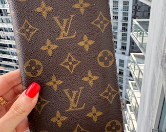 LOUIS VUITTON Vintage LV Monogram Brown Coated Canvas Wallet. Authentic from the 1990(s) Collection. Leather Interior. Made in France.