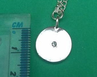 Sparkly token necklace