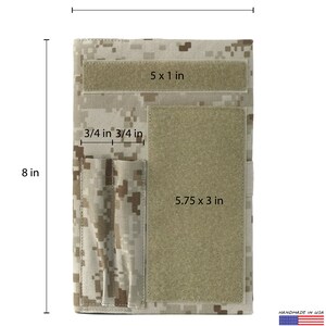 May include: A notebook cover with a digital camouflage pattern. It measures 8 inches tall and 5.5 inches wide. Features include a 5 x 1 inch hook and loop fastener strip, a 5.75 x 3 inch patch, and two 3/4 inch pockets. Handmade in the USA.
