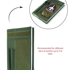 May include: An olive green patch holder with a notebook design. The holder has multiple Velcro panels and pockets. The top of the notebook has the name "SCOTT" and two pens. The notebook has patches that read "FREEDOM FIGHTER".