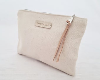 Small cotton pouch with zipper.