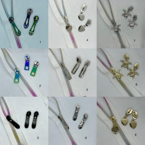 May include: Nine different zipper pulls, each with a unique design. The pulls are made of metal and come in a variety of colours, including silver, gold, and rainbow. The pulls are shown against a white background.