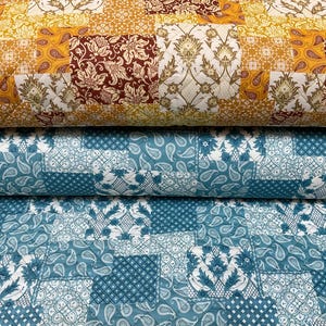 May include: Three folded quilts with patchwork designs. The top quilt features a yellow, brown, and white floral pattern. The middle quilt is teal with paisley and floral motifs. The bottom quilt is teal with a geometric and paisley pattern.