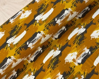 Brush Strokes on Mustard Cotton Jersey Fabric