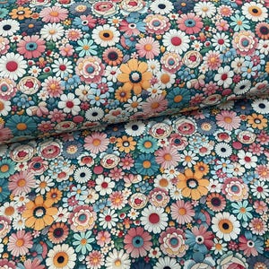 May include: A fabric with a dense floral pattern. The design features a variety of flowers in shades of pink, white, yellow, and blue, set against a dark teal background. The flowers are tightly packed, creating a vibrant and colourful textile.
