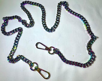 May include: A rainbow iridescent chain with two metal clasps. The chain is made of metal links and is approximately 40 inches long.