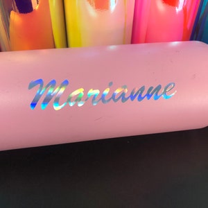 May include: A pink stainless steel water bottle with a holographic sticker that says "Marianne".