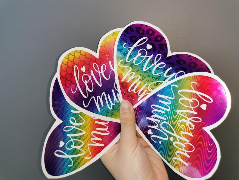 May include: Four rainbow heart-shaped stickers with the text "love you mummy" and "love you forever" in white lettering.