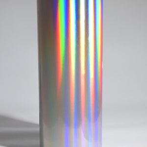 May include: A roll of iridescent silver vinyl with a rainbow sheen.