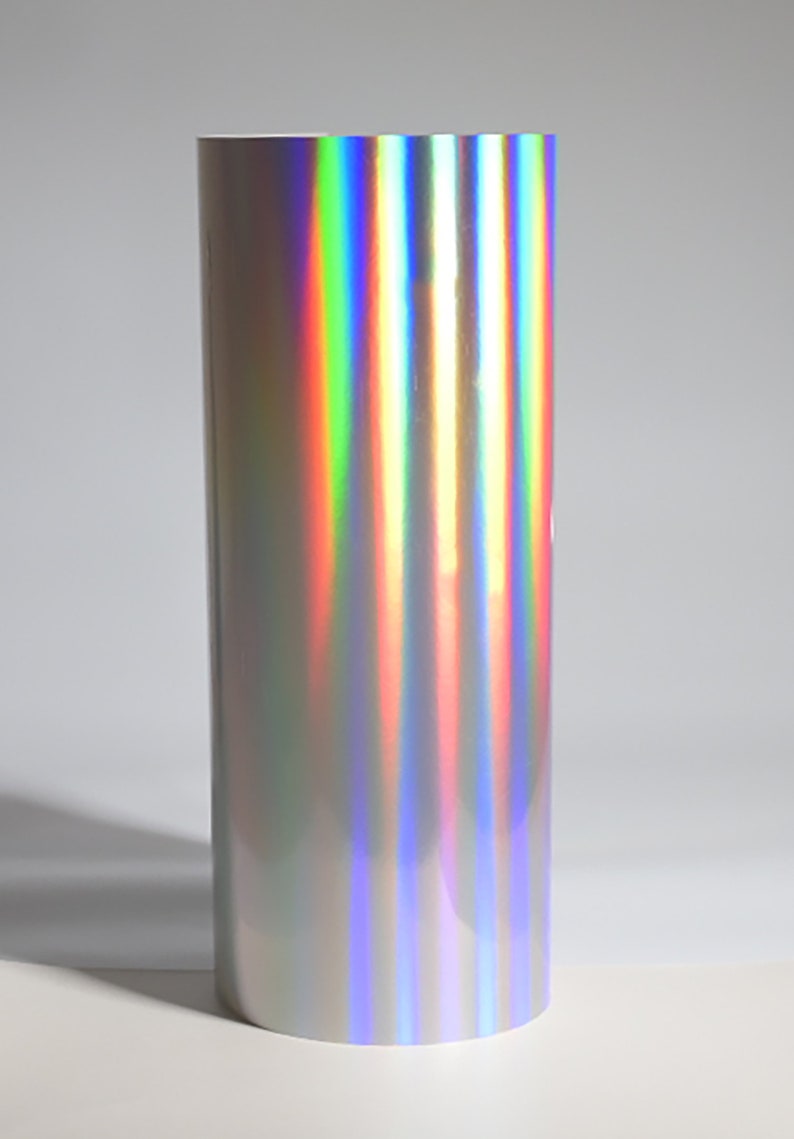 May include: A roll of iridescent silver vinyl with a rainbow sheen.
