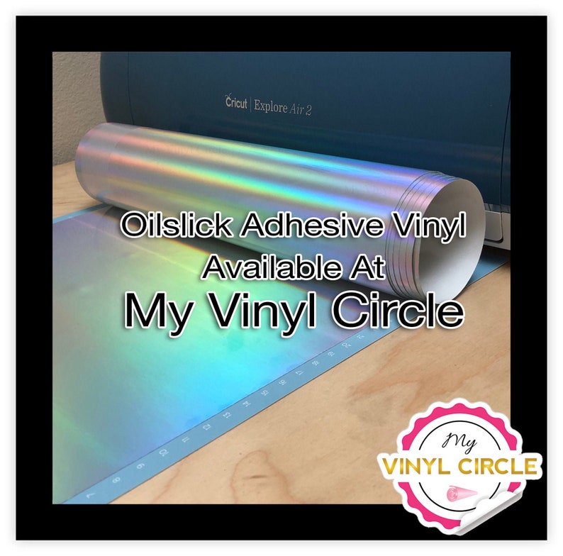 May include: A roll of iridescent oilslick adhesive vinyl, available at My Vinyl Circle. The vinyl is rolled up and sitting on a blue cutting mat with a Cricut Explore Air 2 machine in the background.