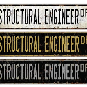 May include: Three vintage-style metal signs with the text "Structural Engineer Dr." in black, gold, and white lettering on a black, white, and black background, respectively.