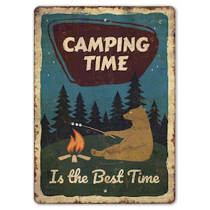 May include: Vintage metal sign with a camping theme. The sign features a bear roasting a marshmallow over a campfire, with the text "CAMPING TIME" and "Is the Best Time". The background is a night sky with trees.