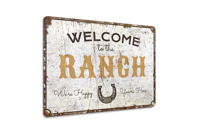 a metal sign that says welcome to the ranch