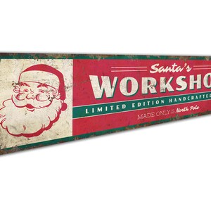 a sign that says santa's workshop on it