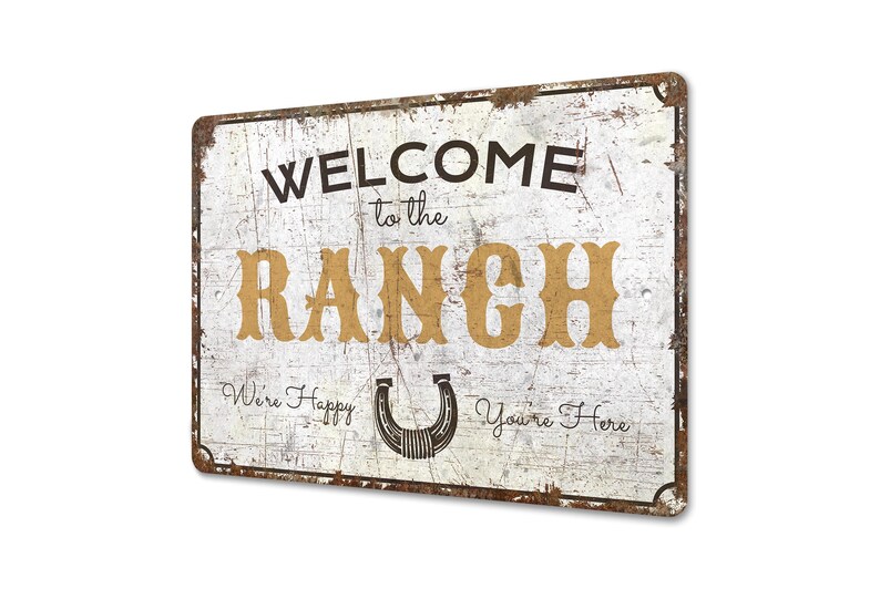 a metal sign that says welcome to the ranch