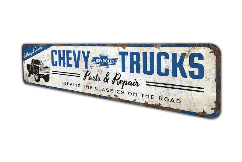 a metal sign that says chevy trucks past and repair