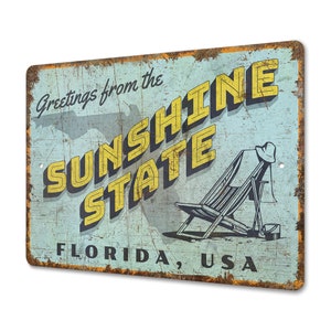 a rusty metal sign that says sunshine state