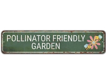 May include: A green metal sign with white text that reads "Pollinator Friendly Garden". Two cartoon bees are flying around a pink flower.