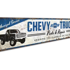 a metal sign that says chevy trucks keeping the classic on the road