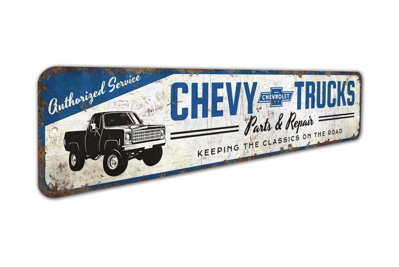 a metal sign that says chevy trucks keeping the classic on the road