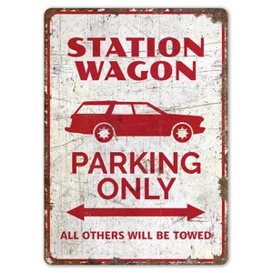 May include: A white metal sign with red text and a red silhouette of a station wagon. The sign reads "Station Wagon Parking Only. All others will be towed."