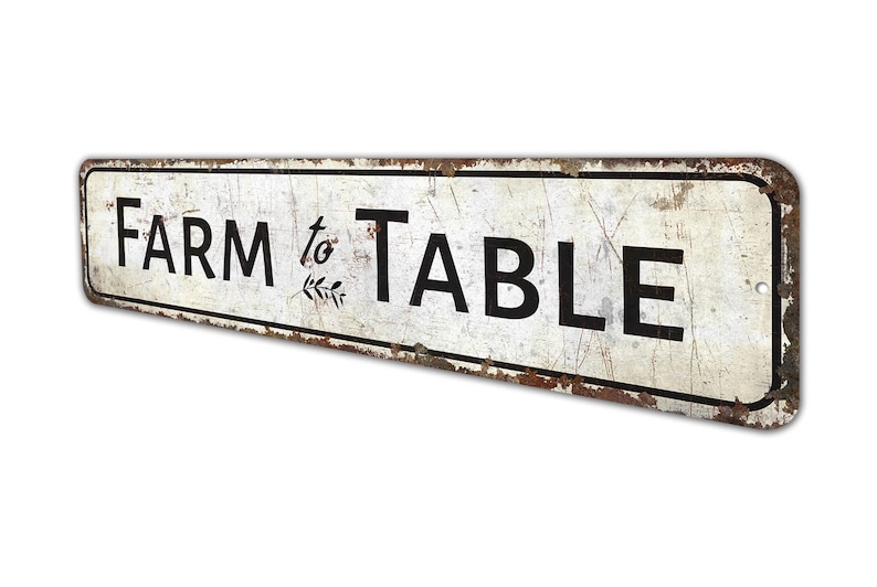 a sign that says farm to table on it