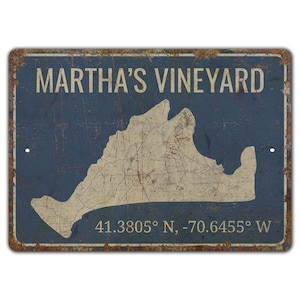 a metal sign with a map of martha's vineyard