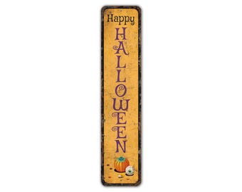 May include: A vertical metal sign with a distressed yellow background and black trim. The sign says "Happy Halloween" in purple letters. The bottom of the sign features a small pumpkin, a candy eye, and some candy.