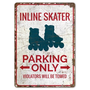 May include: White metal sign with red and blue text and a silhouette of inline skates. The sign reads "INLINE SKATER PARKING ONLY" with the words "VIOLATORS WILL BE TOWED" at the bottom.