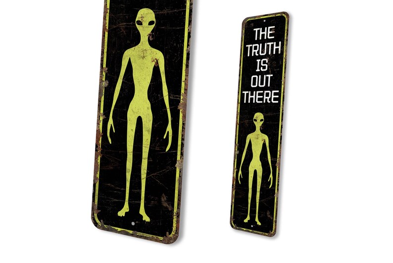 a sign with a picture of an alien on it