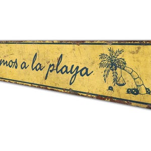 a yellow sign with a picture of a skateboarder