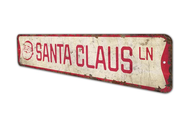 a red and white sign that says santa claus