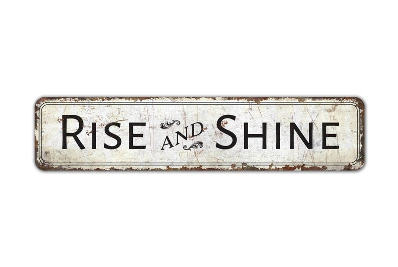 a rusted metal sign that says rise and shine