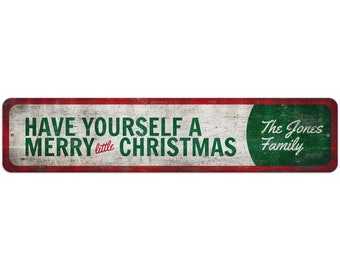 May include: A red and green vintage-style metal sign with white text that reads "Have Yourself a Merry little Christmas" and a green circle with white text that reads "The Jones Family".