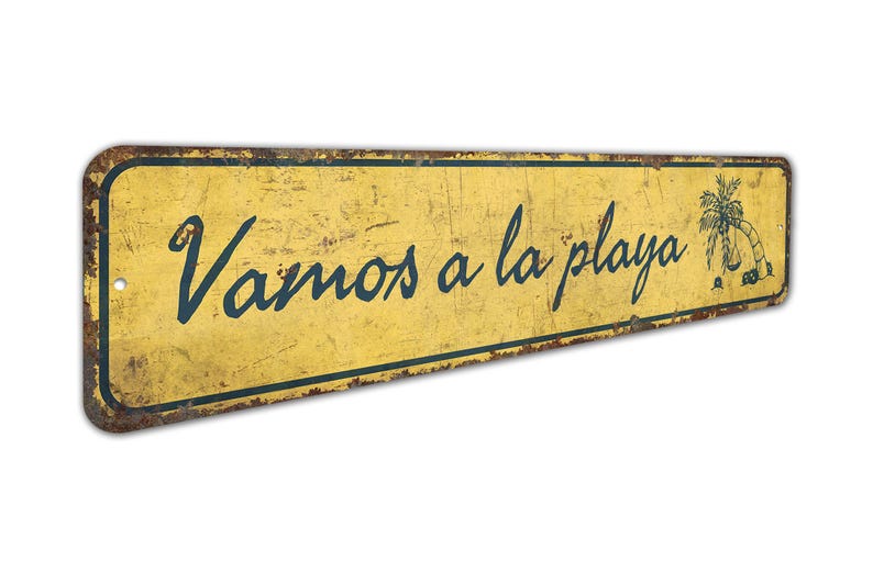 a yellow sign that says vamos a la playa